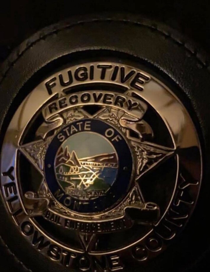 Close-up of a Yellowstone County fugitive recovery badge.